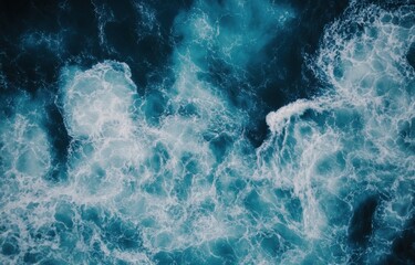 Poster - Aerial view of ocean waves, showing a mesmerizing blend of deep teal water and white foam, creating a dynamic and textured surface. : Generative AI