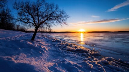 Poster - Serene winter sunset over a frozen lake, a lone tree silhouetted against the vibrant sky, ice floes along the snowy shoreline. : Generative AI