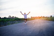 © chaunpis - young man runner running on running road in city park