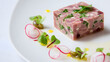 © Thisisbest - Elegant Presentation of Pressed Terrine with Slow Cooked Ham Hock and Fresh Herbs on White Plate