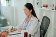 © Wanchai - Healthcare worker dispensing medication to patients during treatment, emphasizing clinical care, safety, and patient health.