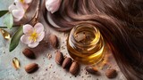 Natural wellness concept with jojoba oil on hair strands and beige fabric