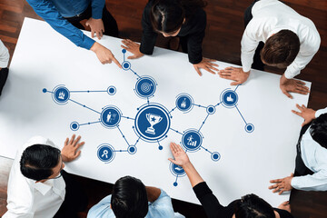 Leinwandbilder - A diverse group of professionals collaborates over a smart design on a table, discussing business strategies and success metrics in a modern office setting. Amity