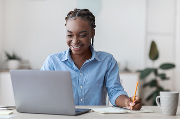 Aufkleber - Online Education. Young Black Female Student Using Laptop At Home And Taking Notes, Smiling African American Woman Enjoying Distance Learning, Watching Webinar In Internet, Copy Space
