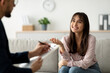 © Prostock-studio - Successful therapy. Arab female client having consultation with psychologist, grateful for professional help. Happy lady speaking with her psychotherapist, solving emotional problem