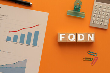 Poster - There is wood cube with the word FQDN. It is an abbreviation for Fully Qualified Domain Name as eye-catching image.