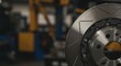 © Vyatcheslav - Disc brake showcasing industrial design in a workshop environment