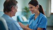 © SarghiArts - Female nurse in scrubs comforting patient during hospital check-up