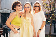 © halayalex - Three young beautiful smiling hipster female in trendy summer stylish clothes. Carefree women posing in the street. Positive models having fun, hugging and going crazy, in sunny day