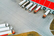 © AlexGo - Aerial Shot of Trucks and Warehouse Loading Docks