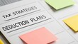 © ANNetz_PK - Whiteboard with tax strategies and deduction plans highlighted by colorful sticky notes.