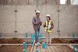 © Wosunan - Engineers and architecture inspect and supervise the construction of building walls and foundations of residential buildings