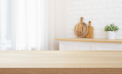 Wall Mural - kitchen table counter top for product presentation on blurred house interior background