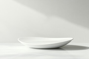 Poster - Elegant empty bowl sits on white surface under soft lighting, aesthetic minimalism
