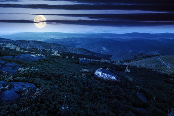 Wall Mural - scenic view of alpine landscape in summer at night. beautiful scene with distant valley in full moon