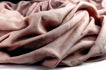 Leinwandbilder - Soft textured fabric draped elegantly on a surface, showcasing its gentle folds and subtle color nuances in natural light