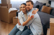 © standret - Embracing each other, sitting. Happy couple moved into new house