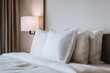 © EpicFade - Hotel Bed with White Pillows Close Up View in Neutral Room Setting for Relaxation and Comfort in Minimalist Style