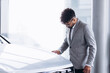 © Petro - Business man choosing a car in car salon