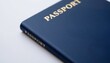 © PoyTumStudio - Blue passport on a white surface, emphasizing travel and identity.