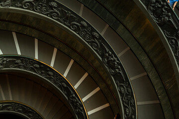 Poster - Stunning close-up of a spiral staircase featuring ornate carvings. Perfect for architecture, design, and luxury themes.