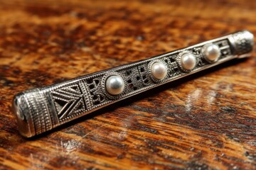 Poster - Ornate silver hairpin with pearls displayed on wooden surface