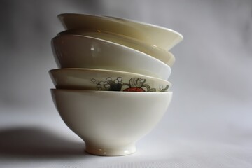 Aufkleber - Stacked ceramic bowls displaying elegant design and craftsmanship, captured in a well-lit indoor setting