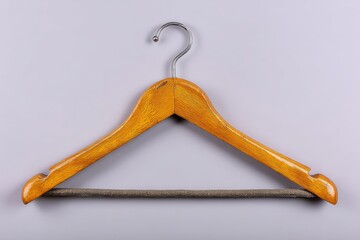 Aufkleber - Wooden hanger with gray fabric strip hanging against a plain background