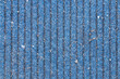 © Виктория Котлярчук - Dirty blue carpet with vertical lines lies on the street as a background
