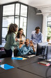 © WavebreakMediaMicro - Celebrating success, business team in modern office around computer, feeling excited