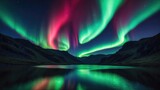 Spectacular green and red aurora reflecting over the hills
