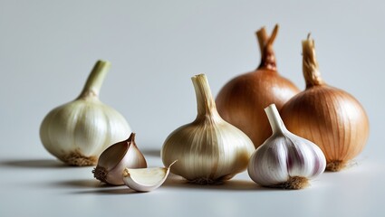 Poster - Fresh garlic and onion bulbs on a white surface