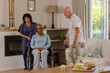 © WavebreakMediaMicro - Senior friends conversing at home, smiling and sharing joyful moments together