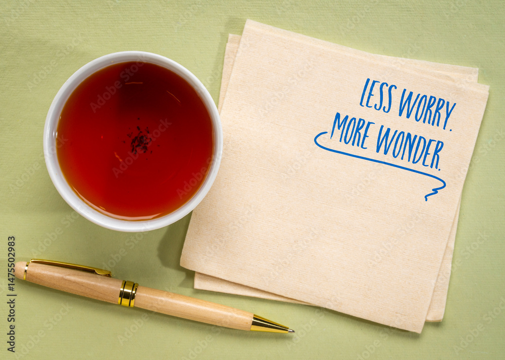 Wonder Positive less worry, more wonder - a positive mindset reminder on a napkin Stock ...
