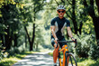 © Evgenii Starkov - Man Cycling Through Lush Park Path