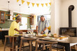 © WavebreakMediaMicro - Senior couple preparing dinner together in modern kitchen, enjoying quality time