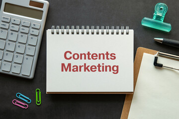 Poster - there is notebook with the word contents marketing. it is as an eye-catching image.