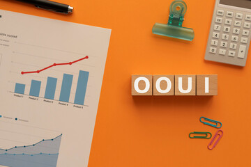 Poster - there is wood cube with the word ooui. it is an abbreviation for object oriented user interface as e