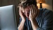 © ZULFA - Stressed Man at Computer, Worried Expression, Overwhelmed by Work