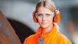 © nurissetiabudi - Employee Wearing Hearing Protection in Loud Industrial Environment