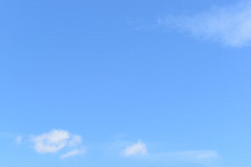Wall Mural - beautiful blue sky and white fluffy group of clouds with sunrise in the morning, natural background