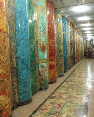 Poster - Ornate Columns in Hallway with Floral Designs and Marble Texture Wide Angle Shot Interior Design Architecture