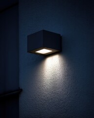 Aufkleber - Modern cube wall light illuminating textured surface with soft glow architectural detail night scene exterior