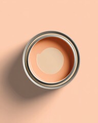 Poster - Top-down studio shot of a paint can filled with peach colored paint on a peach background for home improvement projects