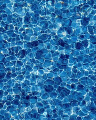 Poster - Abstract blue water ripples in swimming pool creating beautiful light patterns overhead view