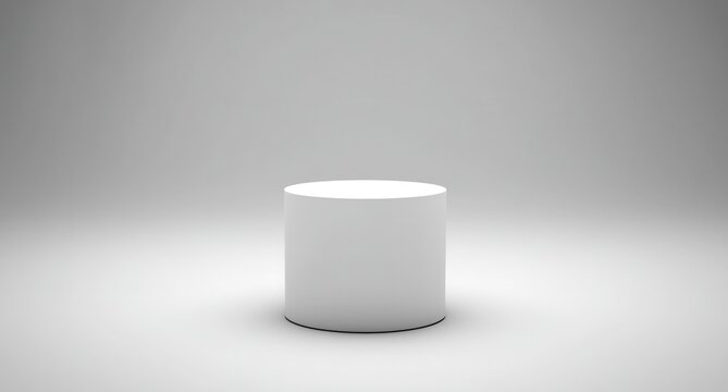 Blank, cylindrical, white pedestal, studio setting.  A simple, round, solid white cylinder stands on a plain, bright, white background
