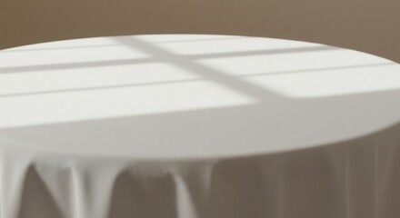 Poster - A minimalist composition of a white tablecloth with shadows from a window above