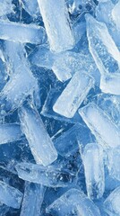 Poster - Close up of pile of ice cubes in cool blue tones for background or texture use studio shot