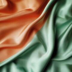 Poster - Abstract close-up of draped silk fabric in peach and green hues; studio shot of flowing textile with soft light and smooth texture