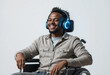 © JELENA - A man in a wheelchair is smiling and wearing headphones